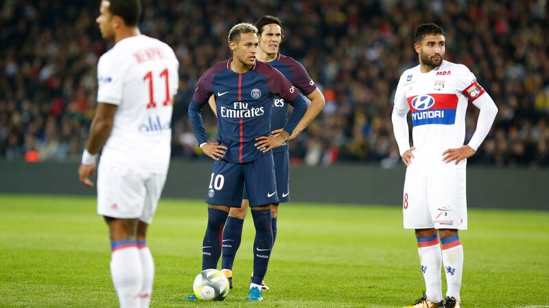 Neymar makes it clear that he is taking a free-kick after Dani Alves had taken the ball off Cavani. Photo: Getty Images