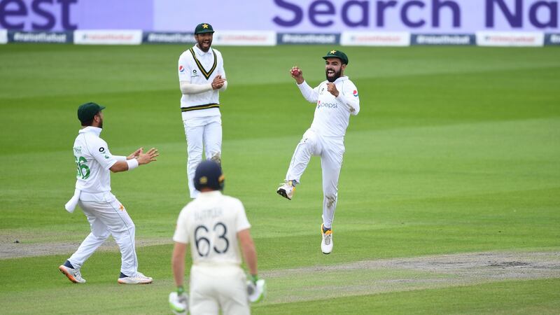 Pakistan celebrate the wicket of Ollie Pope on day four of the first Test at Old Trafford. Photograph: Gareth Copley/Getty