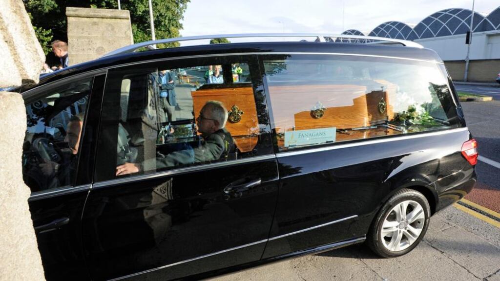 A hearse carrying the remains of poet Seamus Heaney arrives at the Church of the Sacred Heart in Donnybrook. Photograph: Dave Meehan.