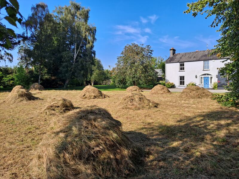 In summer, the front of the property is mowed, its grass stacked in haycocks, the old-fashioned way