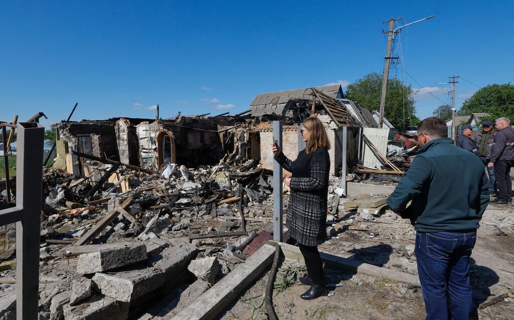 People survey the damage caused by an overnight rocket attack in Krasylivka village, near Kyiv, Ukraine. Photograph: Sergey Dolzhenko/EPA