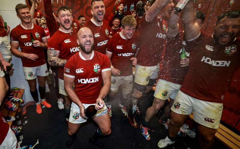 Jamison Gibson-Park leads the celebrations in the Lions' dressingroom after the win over Australia at the MCG. Photograph: Dan Sheridan/Inpho