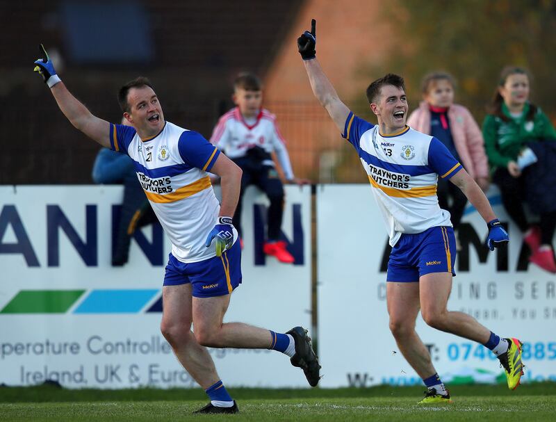 Errigal Ciarán's Dermot Morrow celebrates scoring a point with Ruairí Canavan. Photograph: Leah Scholes/Inpho