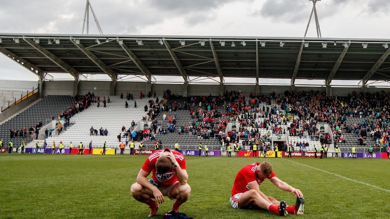 Cork’s Sean White and Mattie Taylor after the final whistle. Photograph: James Crombie/Inpho