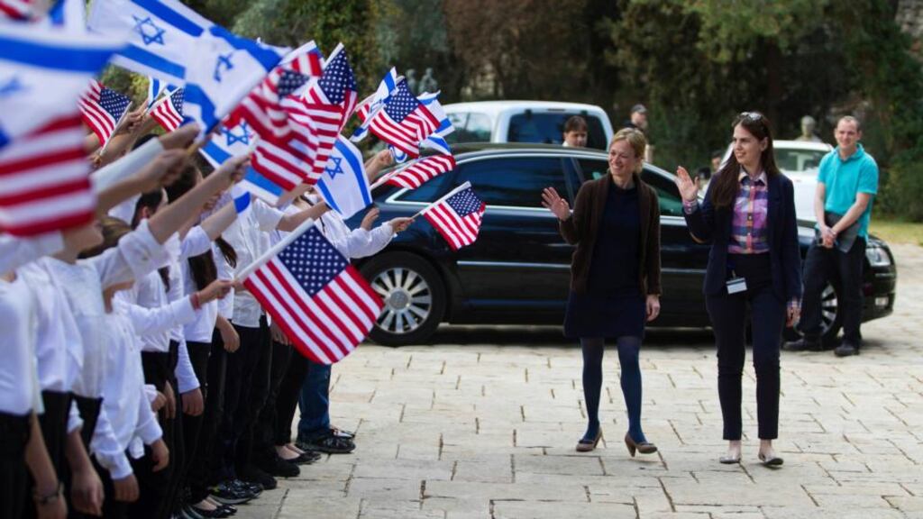 Israeli schoolchildren rehearse holding  the Israeli and US flags as two women stand in for US president Barack Obama and Israeli counterpart Shimon Peres yesterday. Photograph: Baz Ratner/Reuters