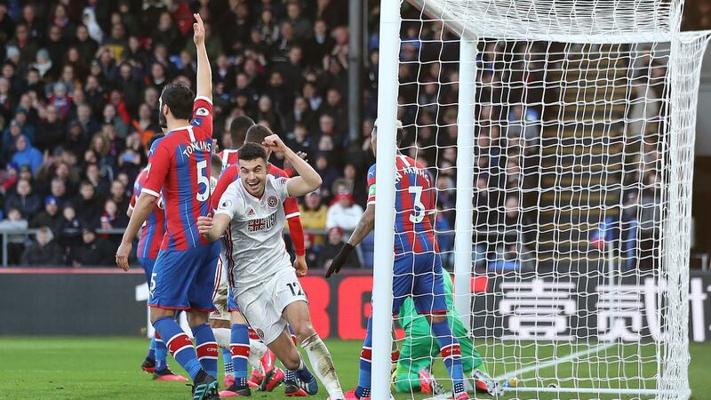 Sheffield United’s John Egan celebrates a Crystal Palace own goal. Photograph: Marc Atkins/Getty Images