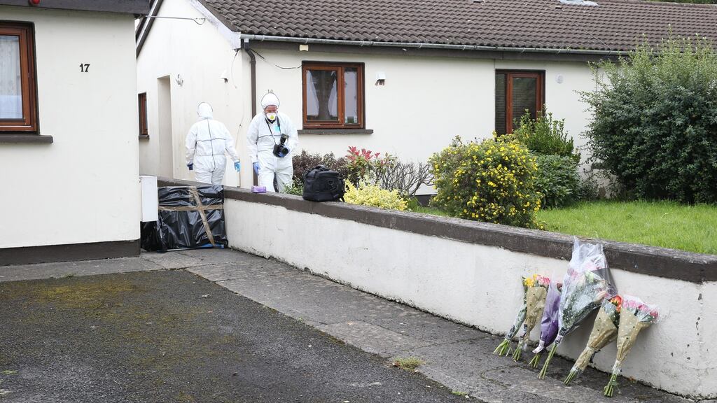 Flowers are left near the location where pensioner Peter McDonald was killed at Whitechapel Road, Clonsilla, Dublin 15.  Photograph: Collins