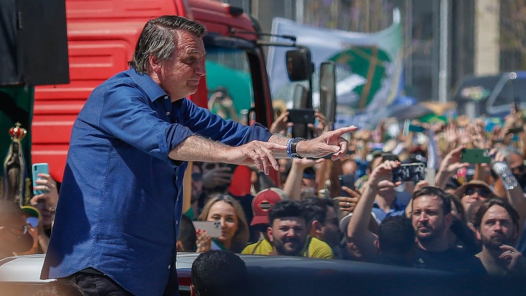 Brazilian president Jair Bolsonaro greets his supporters in Brasília. Photograph: Sergio Lima/AFP via Getty