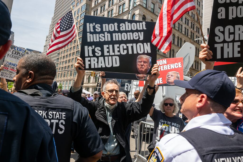 Protesters gather at a news conference held by supporters of former US president Donald Trump outside Manhattan criminal court in New York on Monday. Photograph: Spencer Platt/Getty Images