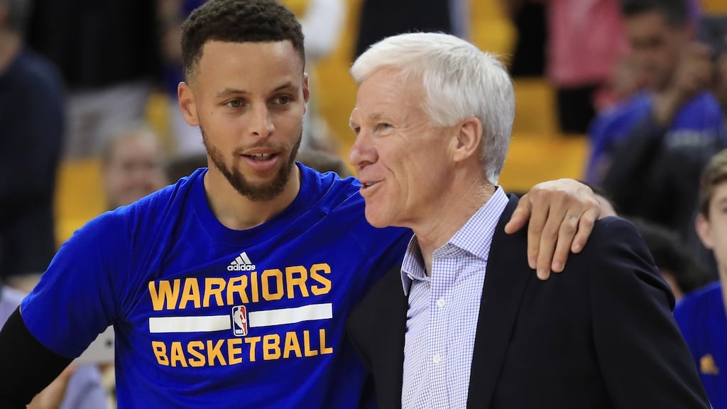 Golden State Warriors point guard Stephen Curry speaks with Davidson head coach Bob McKillop prior to Game 1 of the 2017 NBA Finals in Oakland, California. Photograph: Ezra Shaw/Getty Images