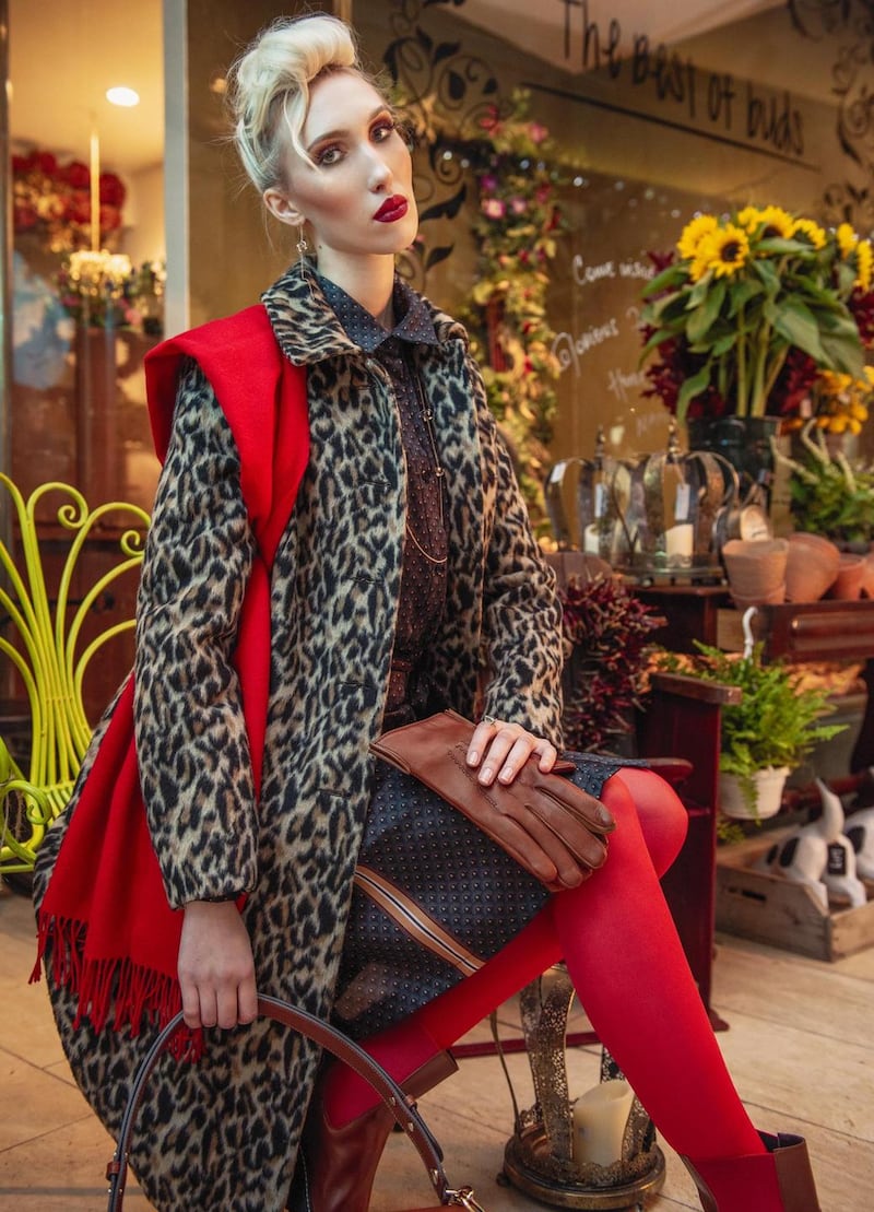Leopard print wool coat €280, striped silk dress €165, red and tan boot €235, tan leather gloves €65, red wool scarf €115, large tan bag Longchamp €1,020, from Monreal, Cork. Rose gold earrings €320, and rose gold necklace €850, both by Hanna Tommola, tourmaline and 18ct rose gold ring by Tuula Harrington €6,950, all from Design Works Studio, Cork