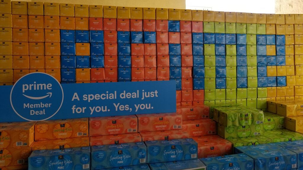 Cases of water stacked to spell out the word Prime, advertising the Amazon Prime service from Amazon, which acquired Whole Foods Market last year. Photograph: Smith Collection/Gado/Getty Images