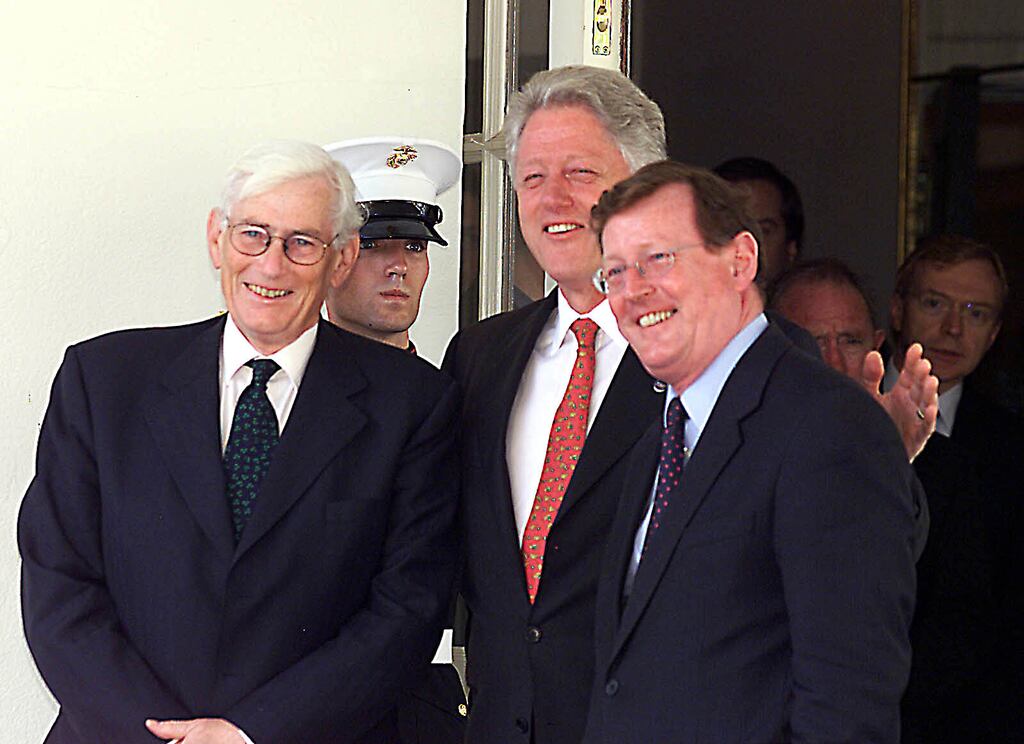 US president Bill Clinton jokes with deputy first minister Seamus Mallon and first minister David Trimble in Washington, 2000. Photograph: PA Wire