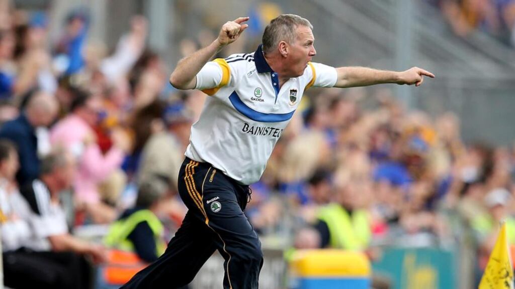 Tipperary manager Eamon O’Shea, who received the backing from his players following the All-Ireland defeat by Kilkenny, urges his side forward. Photograph: James Crombie/Inpho