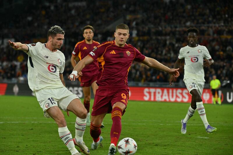 Roma's Ukrainian forward Artem Dovbyk fights for the ball with Lille's during the Europa League game at Stadio Olimpico. Photograph: Filippo Monteforte/AFP via Getty Images
