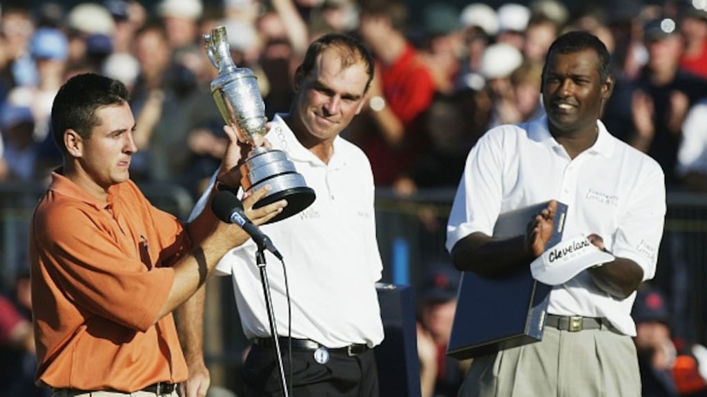 Ben Curtis lifts the Claret Jug as runners up Thomas Bjorn and Vijay Singh applause. File photograph: Getty Images