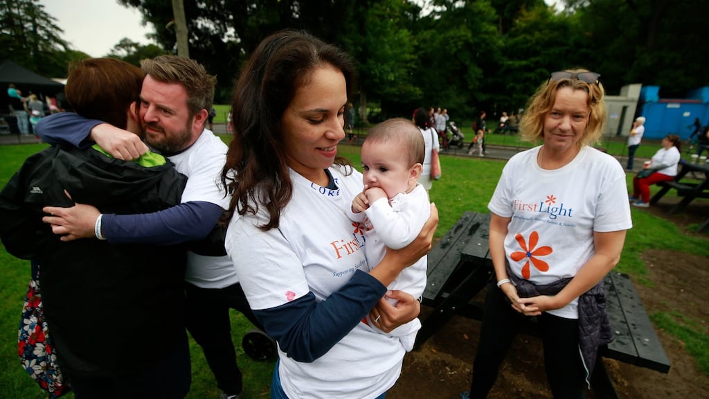 FirstLight members Tomás Fay (left) and Tatiana da Silva Souza with baby Lily. The couple lost their daughter, Lorena,in August 2016. Photograph: Nick Bradshaw