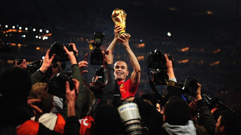 Iniesta holds the World Cup trophy aloft after the 2010 final. Photo: Clive Mason/Getty Images