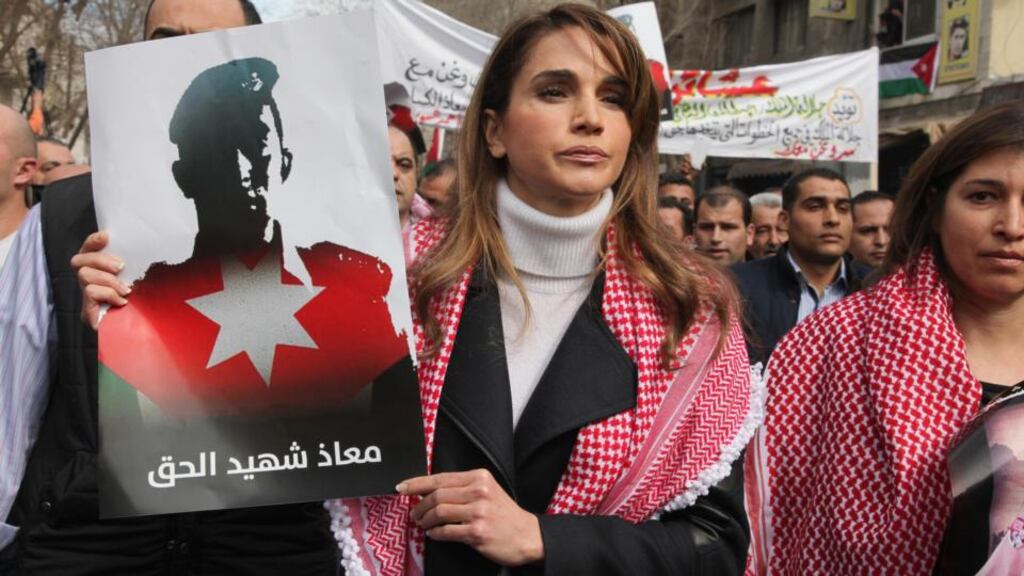Jordan’s Queen Rania holds a picture of pilot Muath al-Kasasbeh who was executed by the Islamic State earlier this year. Photograph: Petra News Agency/Reuters