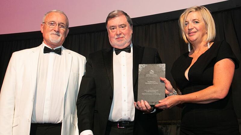 Derry Scully, Group President, Linesight presents the Excellence in Education & Training award to Harry Bent & Marie Henry, Waterford Institute of Technology.