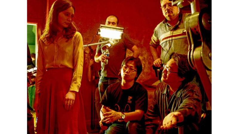 Wasikowska on set with director Chan-wook Park (right).