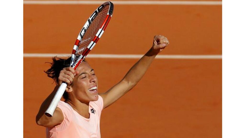 Francesca Schiavone of Italy reacts after defeating Marion Bartoli of France during their semi-final match at the French Open tennis tournament at the Roland Garros stadium in Paris June 2, 2011. - (Photograph: Benoit Tessier/REUTERS)