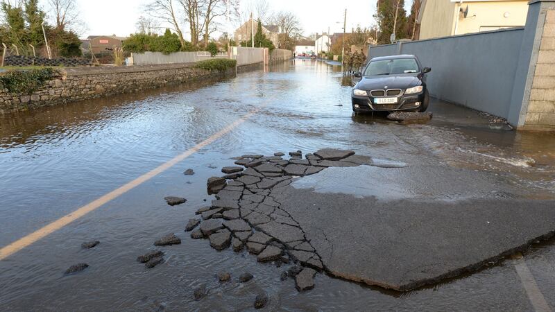 The damaged surface of Manor Road in Mountmellick after local rivers burst their banks on Wednesday. Photograph: Alan Betson/The Irish Times