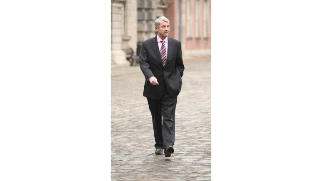 Michael Lowry arriving at the Moriarty tribunal at Dublin Castle
yesterday. "I'm weary, I'm tired of it," he said.