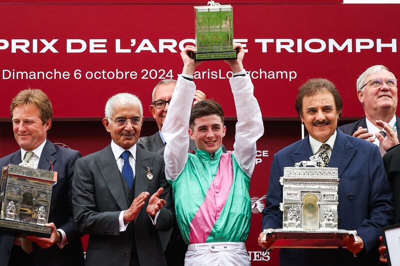 Irish jockey Rossa Ryan holds the trophy as he celebrates with Sheikh Abdullah Bin Khalifa Al Thani of Qatar (second from left) and Saudi Prince Saud bin Khaled bin Abdul rahman Al Saud (second from right) during the podium ceremony of the Qatar Prix de l'Arc de Triomphe. Photograph: Anne-Christine PoujoulatT/AFP via Getty Images
