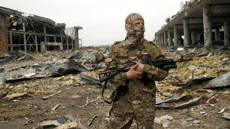 A member of the self-proclaimed Donetsk People’s Republic forces stands guard near buildings destroyed during battles with Ukrainian armed forces, at Donetsk airport, Ukraine, June 1st, 2016. Photograph: Alexander Ermochenko/Reuters