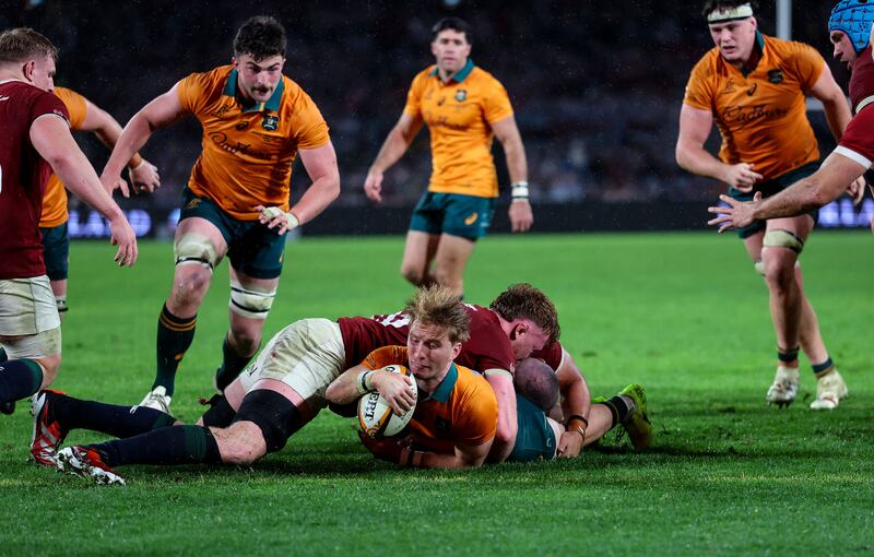 Tate McDermott scores a try for the Wallabies. Photograph: James Crombie/Inpho