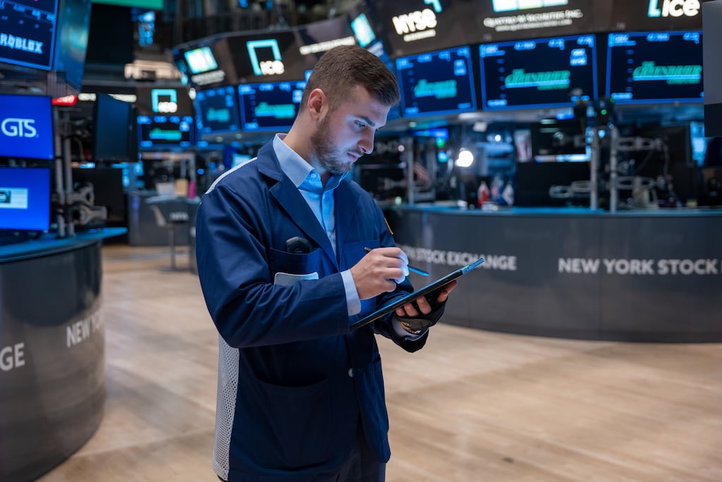 Traders work on the floor of the New York Stock Exchange on Monday. The S&P 500 and the Nasdaq recouped some of the previous week’s losses on Monday. Photograph: Spencer Platt/Getty Images