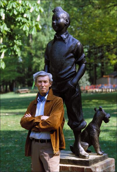 Hergé stands in front of a Tintin statue in Brussels in 1982. Photograph: Bernard Charlon/Gamma-Rapho via Getty Images