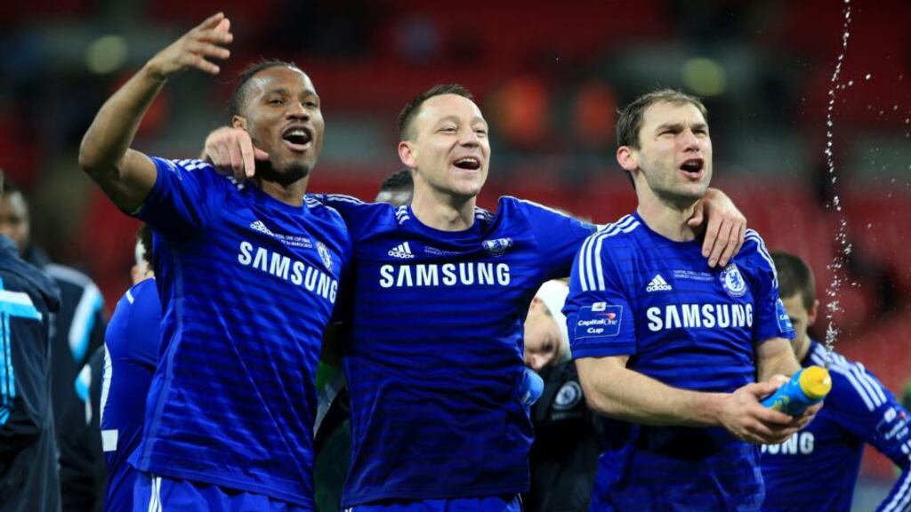 Didier Drogba, John Terry and Branislav Ivanovic celebrate Chelsea’s League Cup final win over Spurs. Photograph: PA