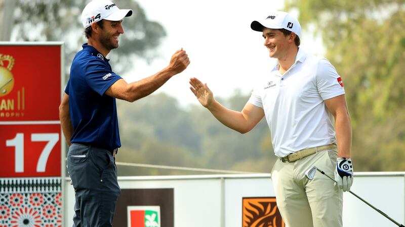 Paul Dunne celebrates his hole in one on the 17th hole with Edoardo Molinari during the second round of the Trophee Hassan II at Royal Golf Dar Es Salam last April. Photo: Andrew Redington/Getty Images