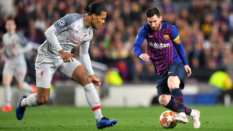 Lionel Messi, then of Barcelona, running at Liverpool defender Virgil van Dijk in 2019. Photograph: Michael Regan/Getty