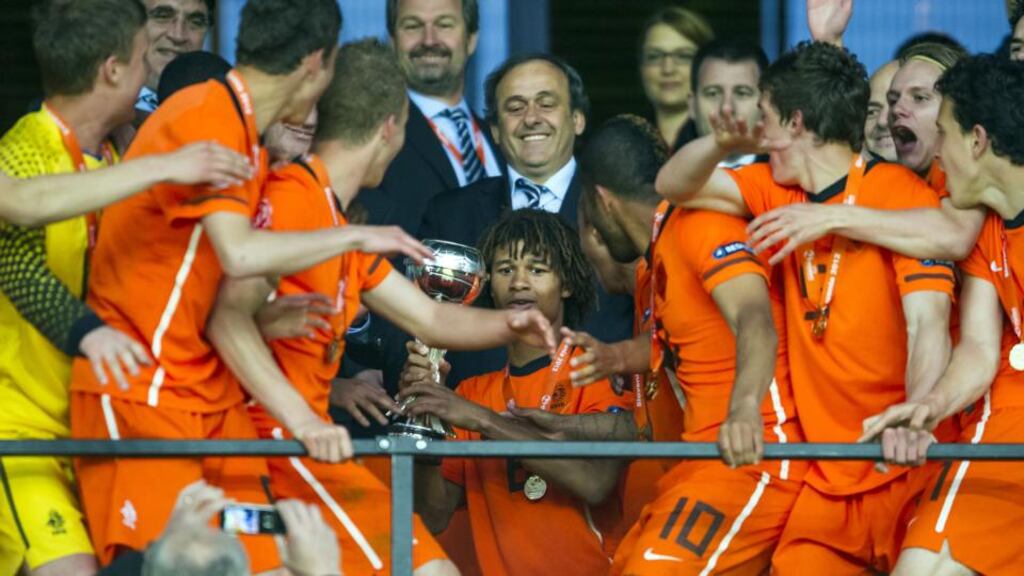 Nathan Ake (center, with the cup), captain of Netherlands U-17 team accepts the cup from Michel Platini, president of Uefa after winning the European Under-17 Football Championship final match between Germany and Netherlands in Ljubljana on May 16th, 2012. Photograph: Jure Makovec/AFP/GettyImages