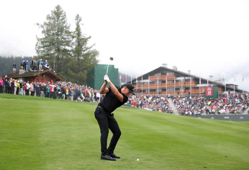 Matt Wallace of England playing his superb second shot to the 18th hole to set up a winning birdie in the play-off at the Omega European Masters 2024 at Crans-sur-Sierre Golf Club in Crans-Montana, Switzerland. Photograph: Warren Little/Getty Images