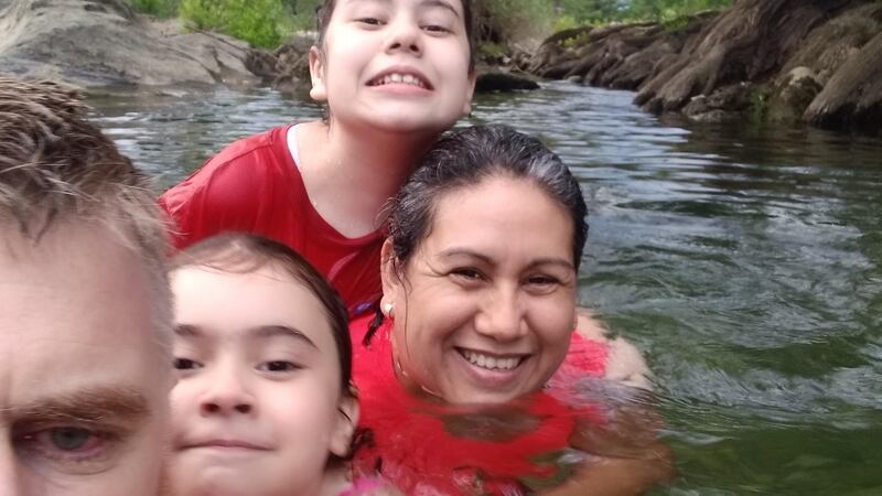 Colin Carberry with his daughters Emma  and Kathleen Carberry Garza (centre left and right) and his wife Verónica Garza Flores