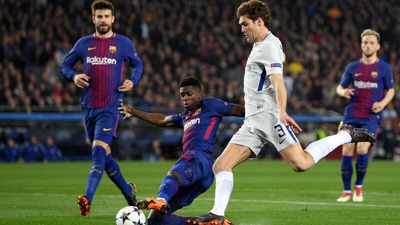 Marcos Alonso of Chelsea is tackled by Ousmane Dembele of Barcelona during the Champions League round of 16 second leg match at Camp Nou. Photograph: Shaun Botterill/Getty Images