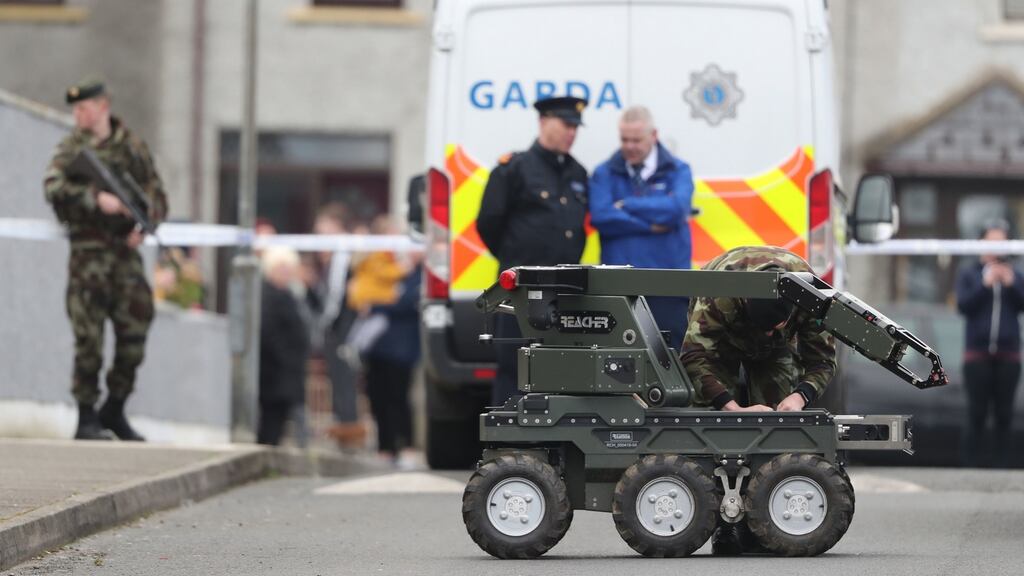 Gardaí and an army bomb disposal robot at the scene of an unexploded bomb in the estate in Drogheda, Co Louth. Photograph: Niall Carson/PA Wire