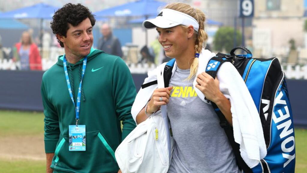 Rory McIlroy and his girlfriend Caroline Wozniacki, who rejects the suggestion that their relationship is affecting their respective sporting careers.