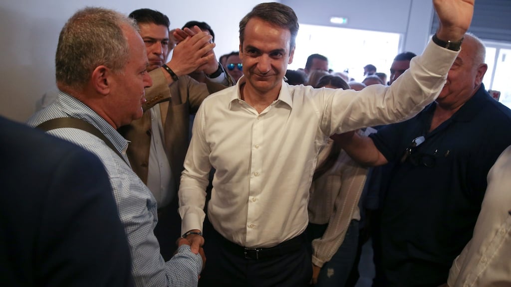 New Democracy conservative party leader Kyriakos Mitsotakis is greeted by supporters as he arrives at the party’s headquarters in Athens, Greece on Sunday. Photograph: Costas Baltas/Reuters