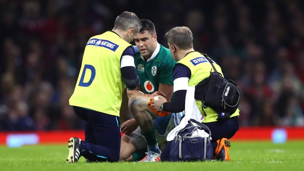 Ireland’s Conor Murray gets treatment on his shoulder during the defeat in Cardiff on Friday. Photograph: James Crombie/Inpho