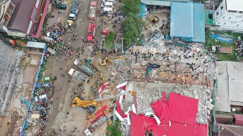 An overhead view of a collapsed under-construction building in Sihanoukville, Cambodia. Photograph: Reuters