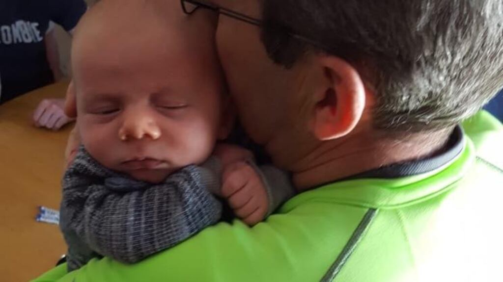 Caleb asleep in Enda’s arms.