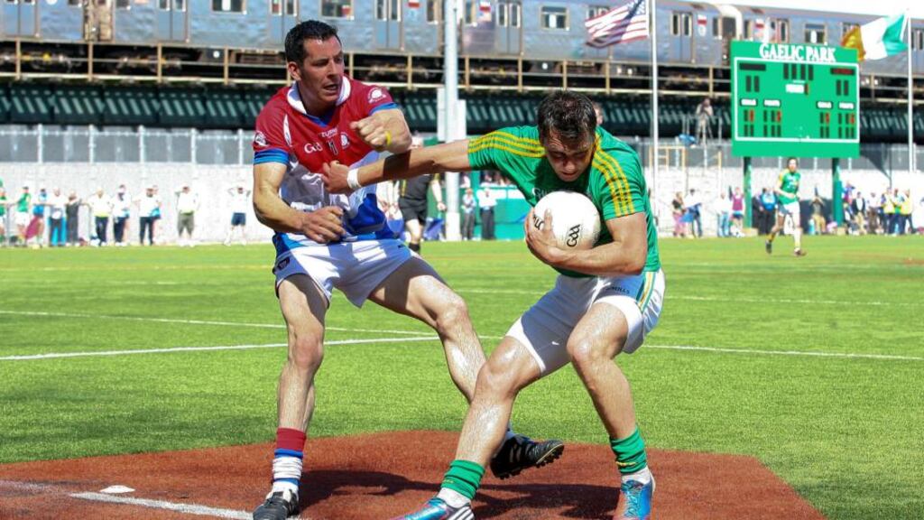 Leitrim’s Paul Brennan is tackled by New York’s Jason Kelly at the Gaelic Ground. Photo: Ed Mulholland/Inpho