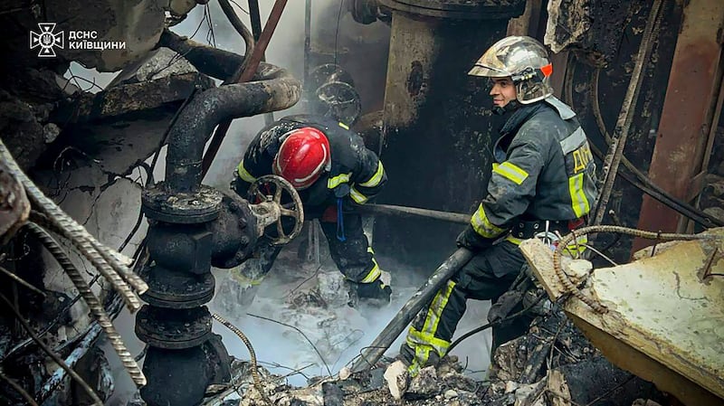Emergency workers extinguish a fire after a Russian attack on the Trypilska thermal power plant in Ukrainka, Kyiv region. Photograph: Ukrainian Emergency Service/AP