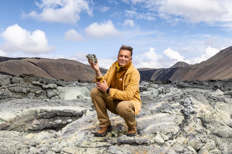Chris Packham inspecting an igneous rock/solidified magma on the Fagradalsfjall volcano, Iceland. Photograph: BBC