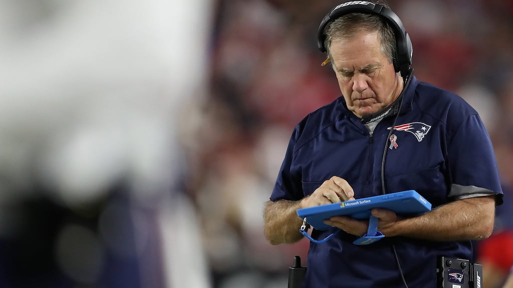 The high-profile head coach of the American football’s most dominant team, New England Patriots coach Bill Belichick, chucked Microsoft’s new Surface tablet computer into the stands in full view of the crowd and thousands of TV viewers.